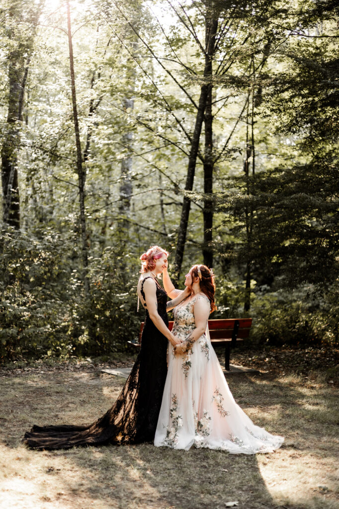 Brides face each other while caressing at this forest elopement in Langley