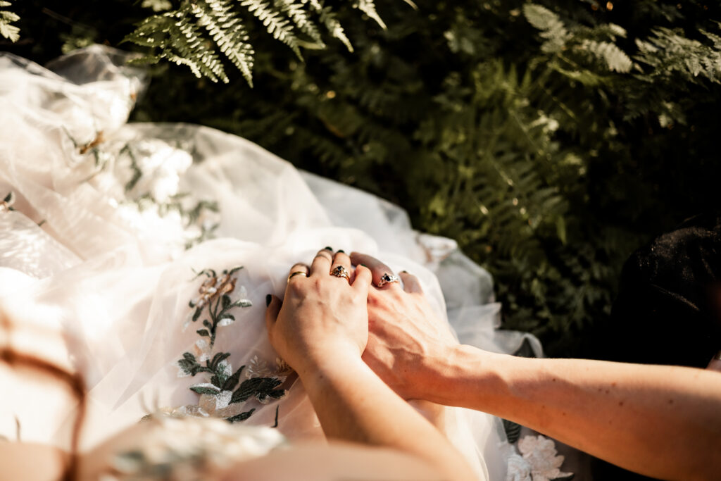 Brides show off their rings at this forest elopement in Langley