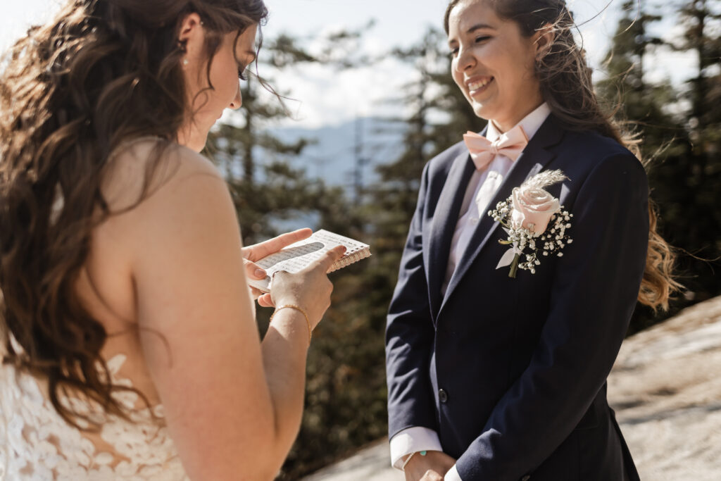 Kat reads her vows to Melissa at this Sea to Sky Gondola wedding