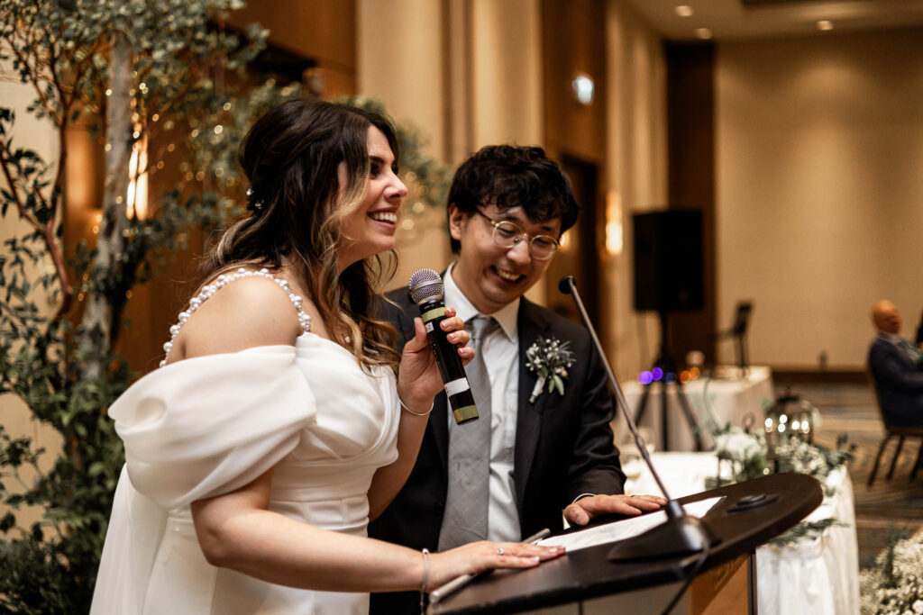 The bride and groom give a thank you speech at their downtown Vancouver Marriott Pinnacle wedding