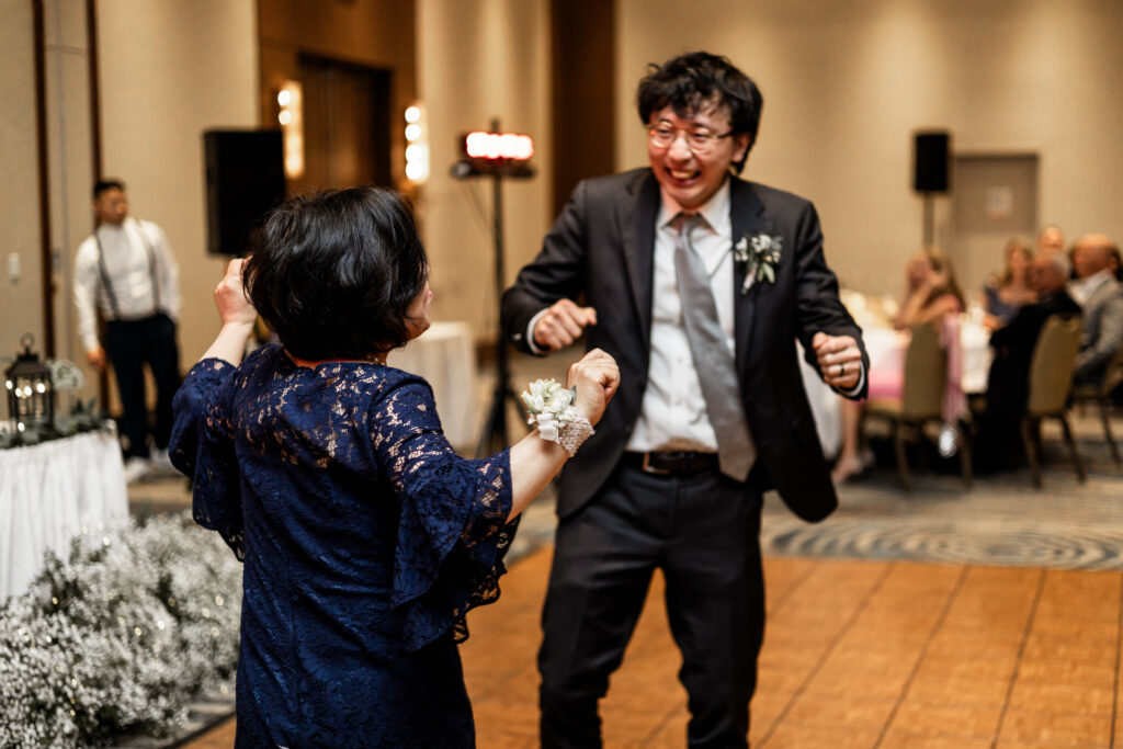 The groom has a dance with his mother at this downtown Vancouver Marriott Pinnacle wedding