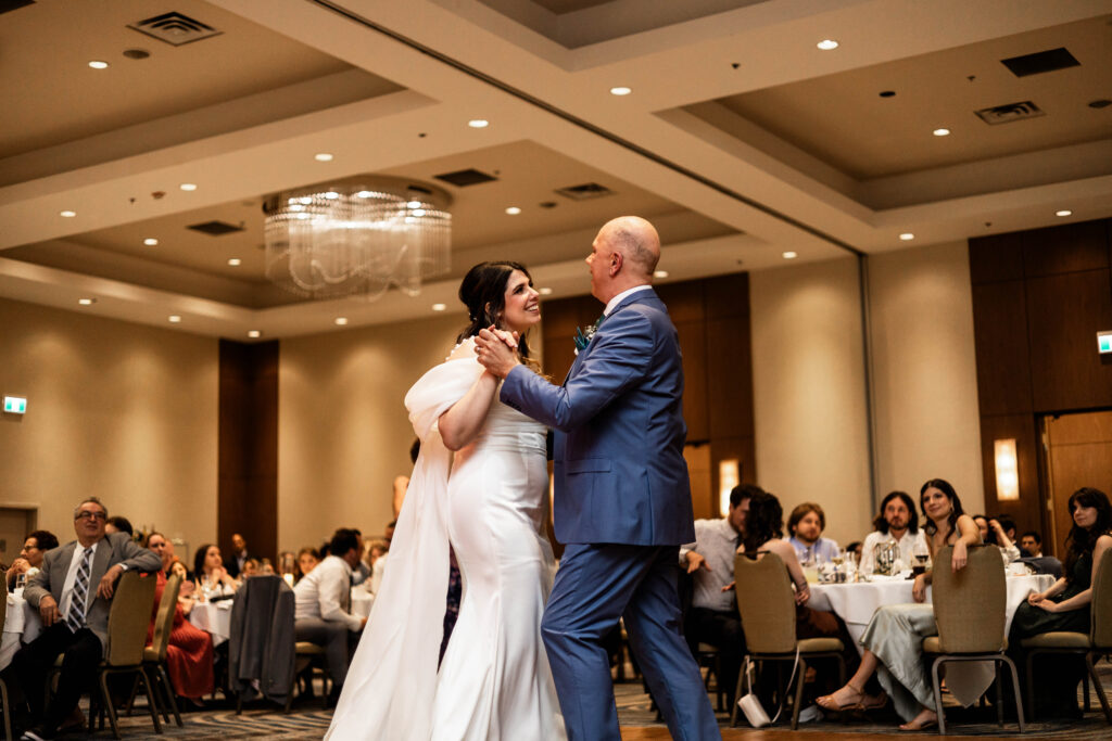 The bride has a dance with her father at this downtown Vancouver Marriott Pinnacle wedding