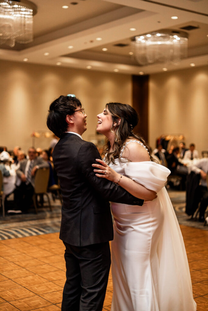 The bride and groom have a first dance at their downtown Vancouver Marriott Pinnacle wedding