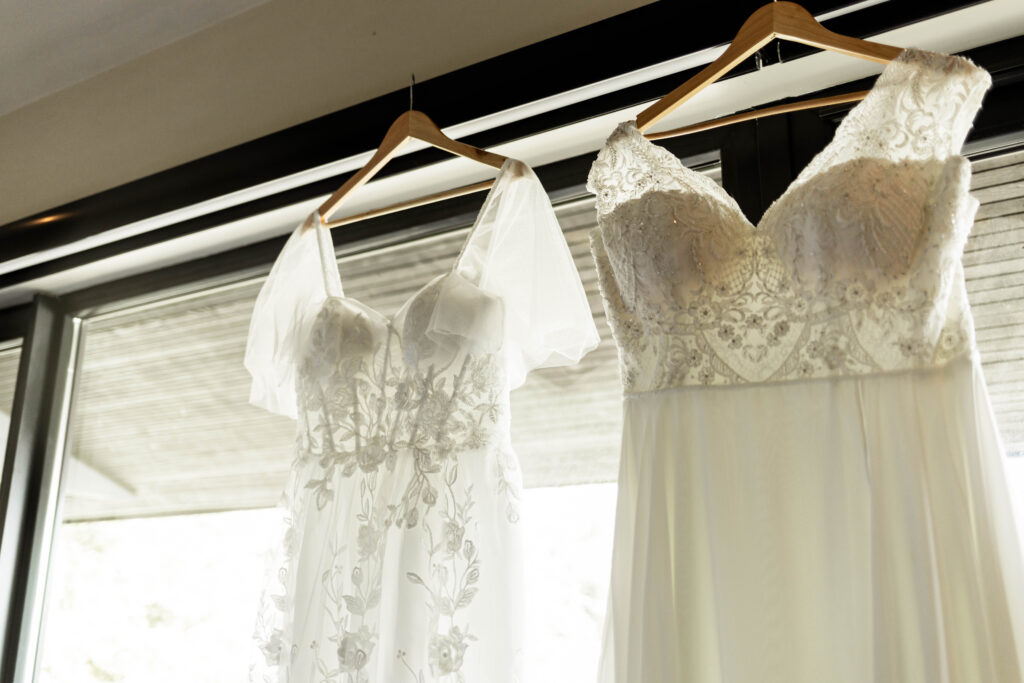 Dresses hanging in the window at a Black Rock Oceanfront Resort wedding.