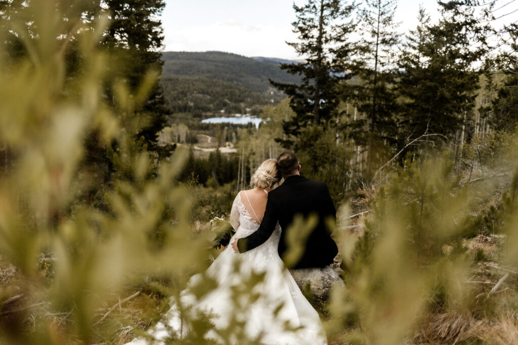 Bride and groom admire the view at this cabin elopement