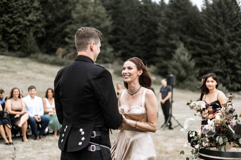 Bride laughs as she looks at her groom at this Church and State Winery wedding