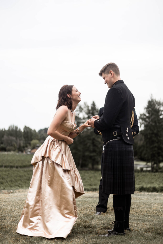 Bride and groom exchange rings at this Church and State Winery wedding