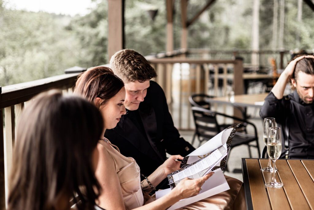 Bride and groom read their marriage papers at this Church and State Winery wedding