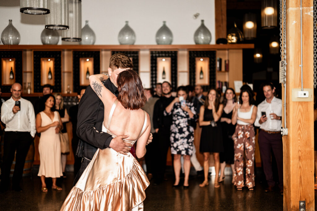 Bride and groom have their first dance at this Church and State Winery wedding