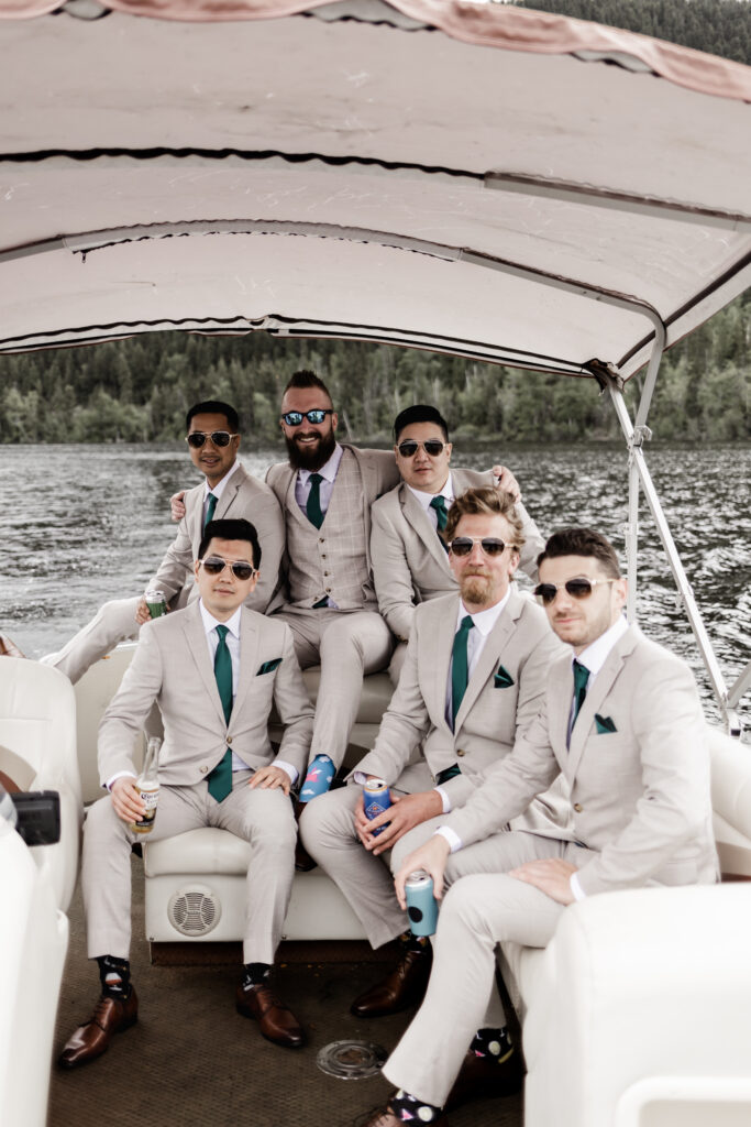 The groomsmen pose on the pose at this canim lake wedding