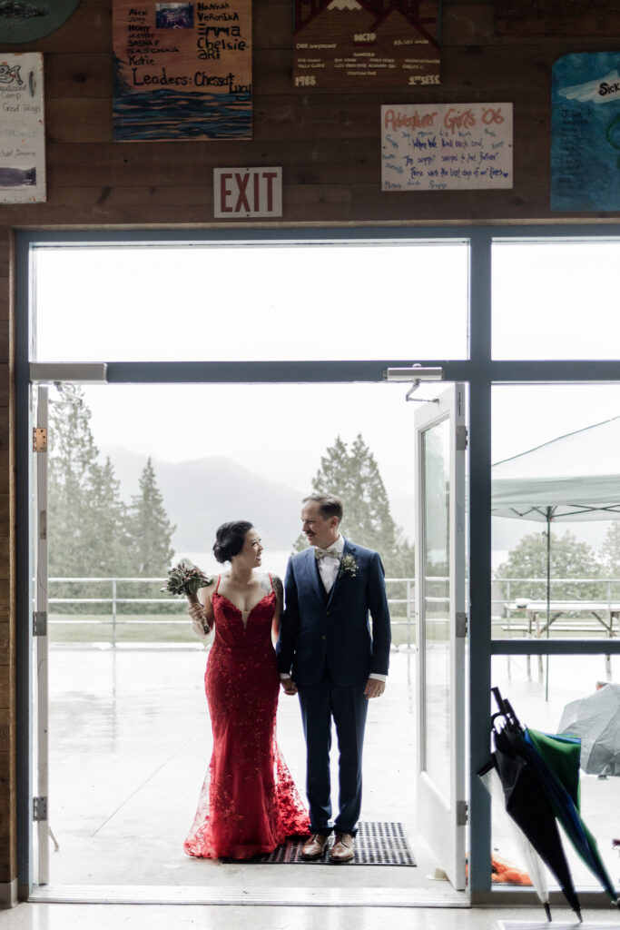 The bride and groom enter their reception at this Gibsons Island summer camp wedding at Camp Elphinstone