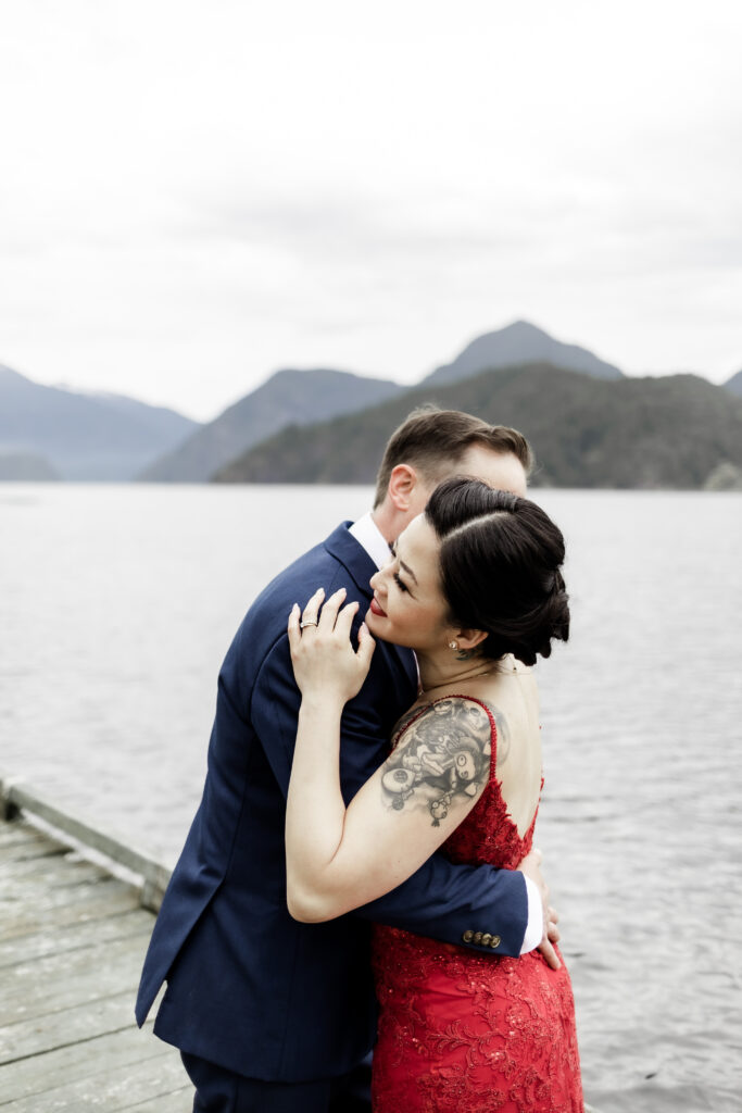 The newly weds share a hug at their Gibsons Island summer camp wedding at Camp Elphinstone