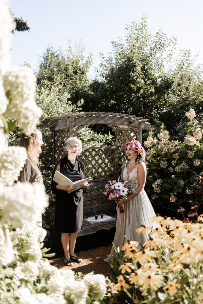 Bride and groom smile at each other at the altar at this Vancouver Island costume wedding