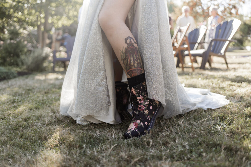 Bride shows off floral dock martens at this Vancouver Island costume wedding