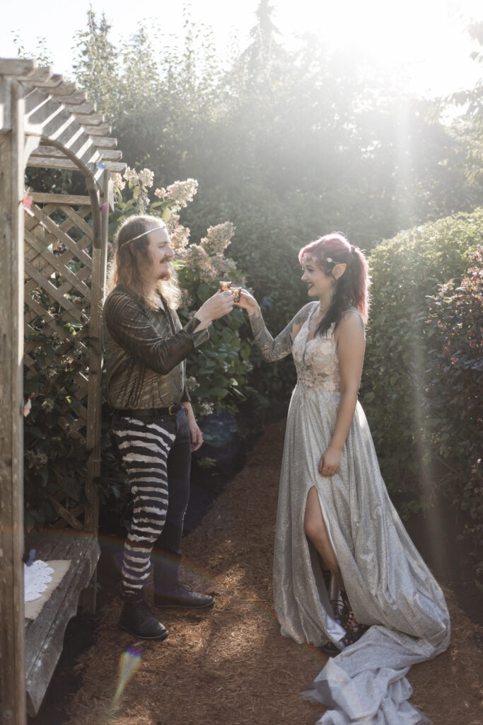 bride and groom take a shot together at this Vancouver Island costume wedding