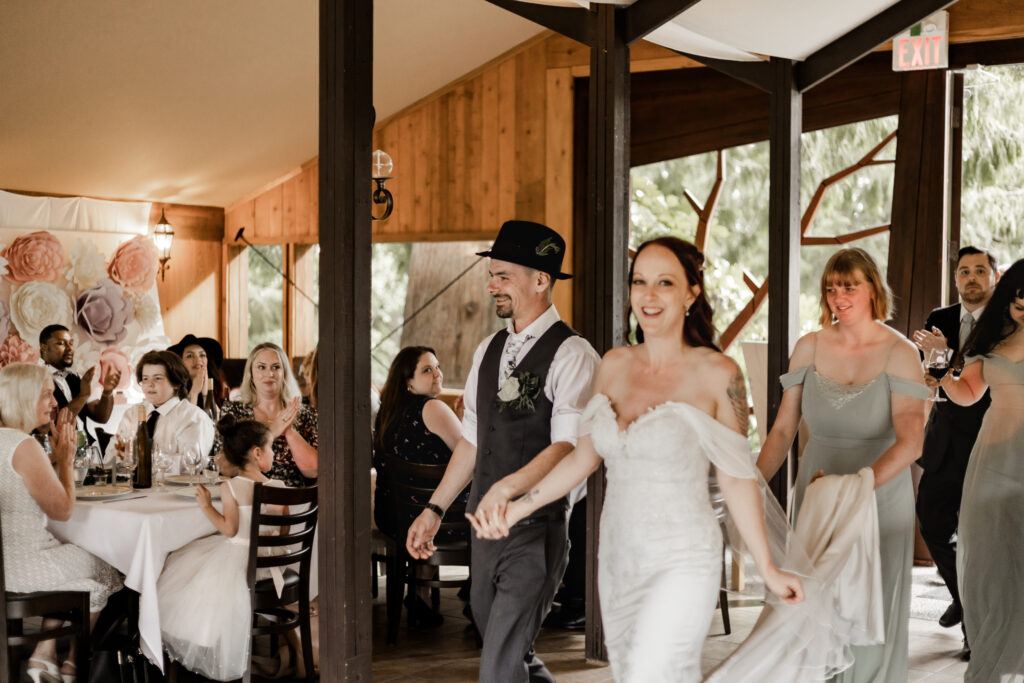 bride and groom enter the reception at this Cobble Hill Winery wedding