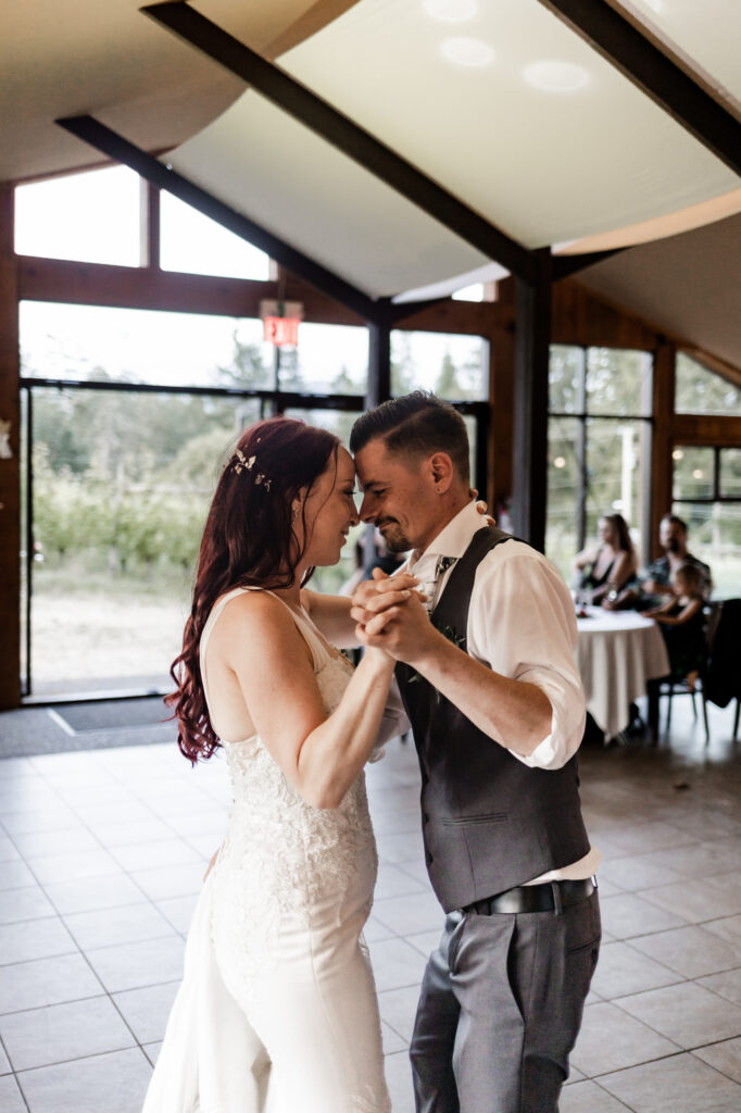 bride and groom have a first dance at this Cobble Hill Winery wedding