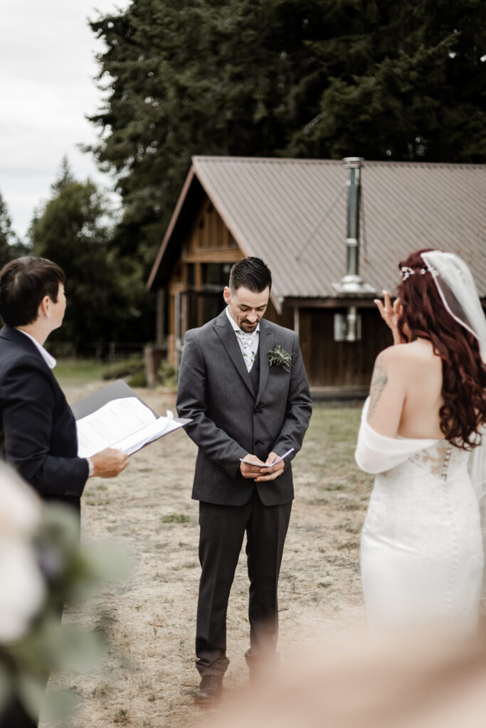 groom reading vows at this Cobble Hill Winery wedding