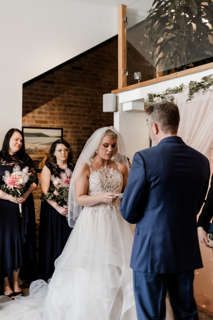 bride reads her vows to her groom at this downtown Victoria wedding