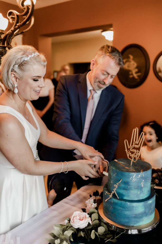 bride and groom cut their cake at this downtown Victoria wedding