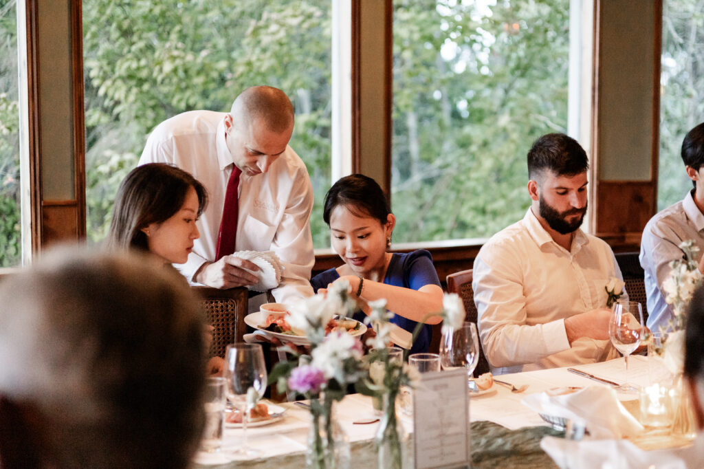 guests eat appetizers at seasons in the Park at this Bloedel Conservatory wedding 