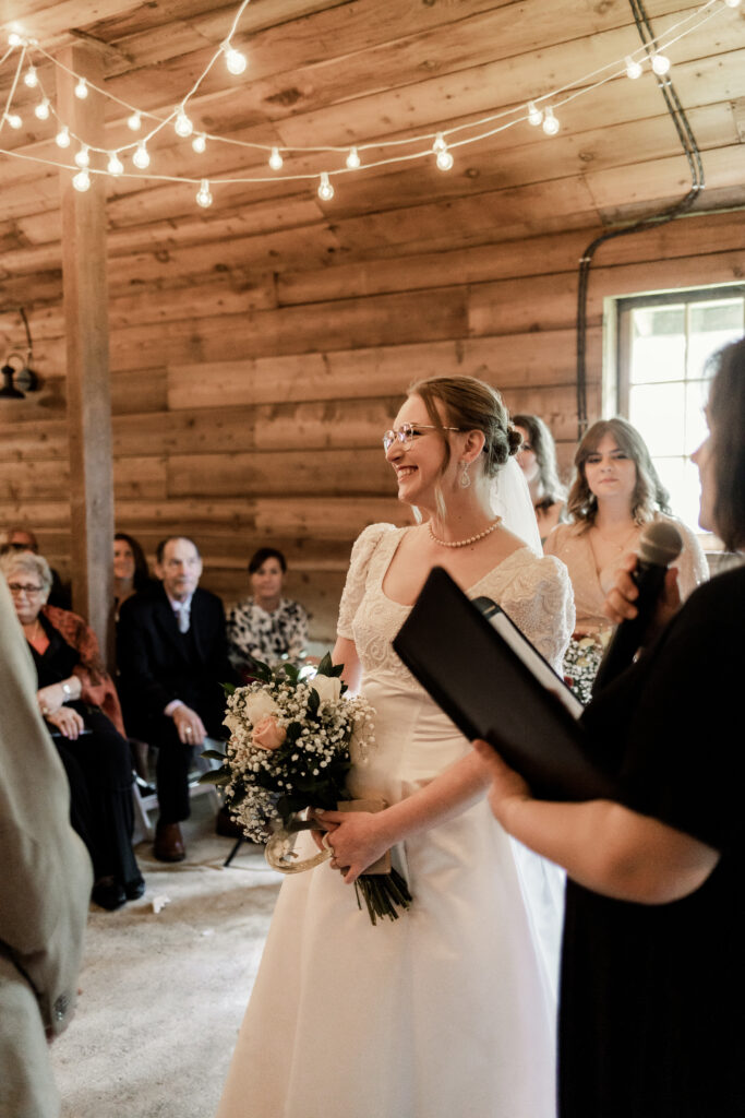 The bride smiling at the altar at this Estate 248 wedding in Langley, British Columbia