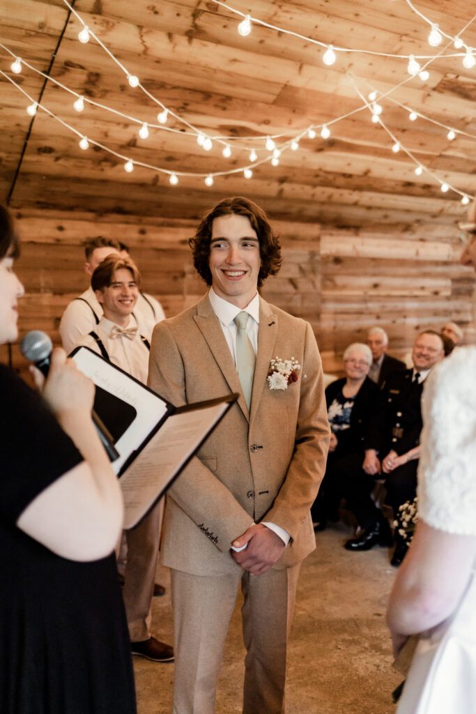 The groom smiling at the altar at this Estate 248 wedding in Langley, British Columbia