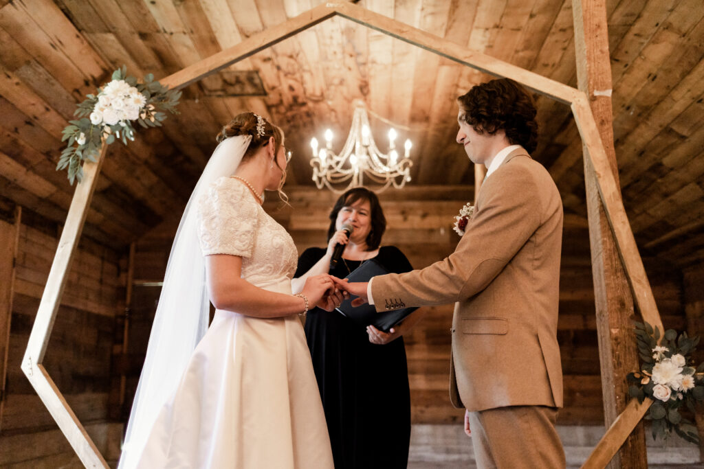 The bride and groom exchange rings at this Estate 248 wedding in Langley, British Columbia