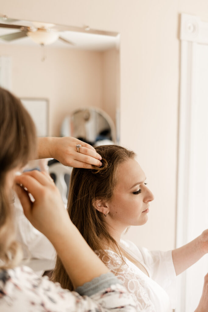 The bride getting her hair done at her Estate 248 wedding in Langley, British Columbia