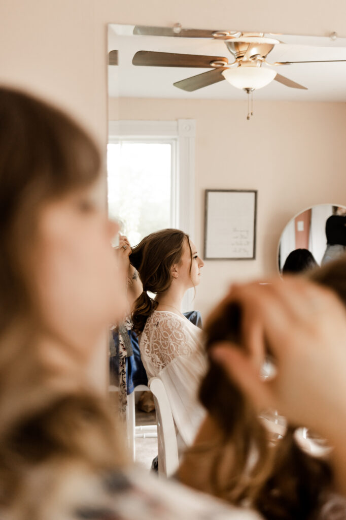 The bride getting her hair done at an Estate 248 wedding in Langley, British Columbia