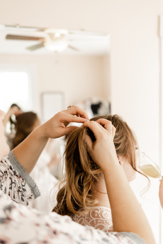 The bride getting her hair done at an Estate 248 wedding in Langley, British Columbia