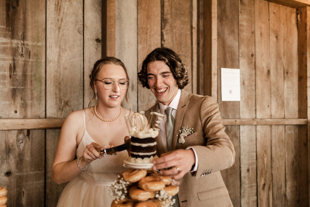 bride and groom cut a small cake at this Estate 248 wedding in Langley, British Columbia