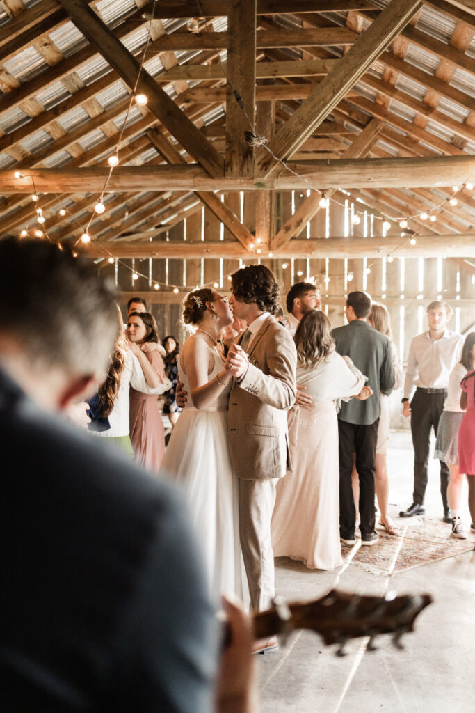 from the perspective of the guitar player, bride and groom slow dancing at this Estate 248 wedding in Langley, British Columbia