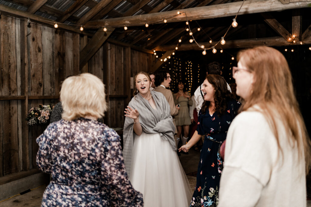 bride and groom dancing with their friends during their reception at this Estate 248 wedding in Langley, British Columbia