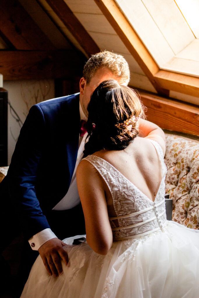 Bride and groom share a kiss after exchanging gifts at this Bird's Eye Cove wedding