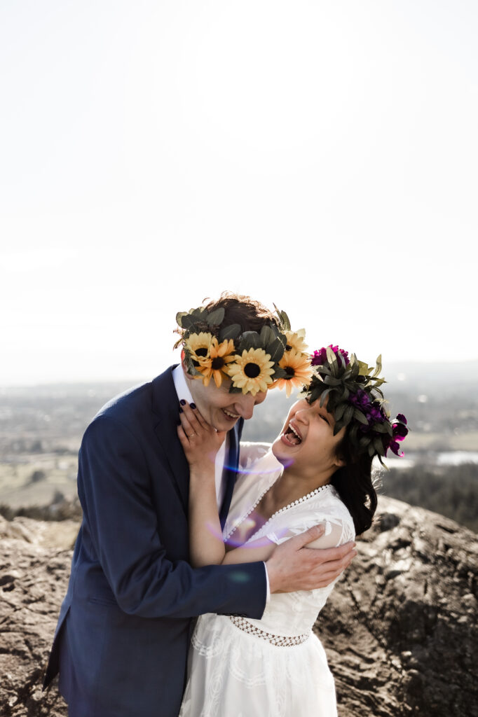 The bride and groom laugh together at their Mount douglas elopement