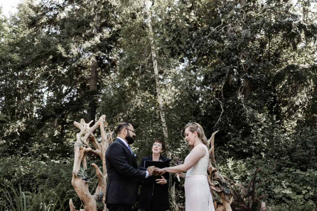 bride and groom standing at the altar at this Victoria wedding at uvic