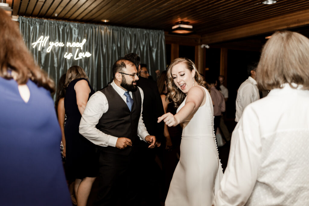 A couple dance together on the dance floor at their wedding in Victoria, BC