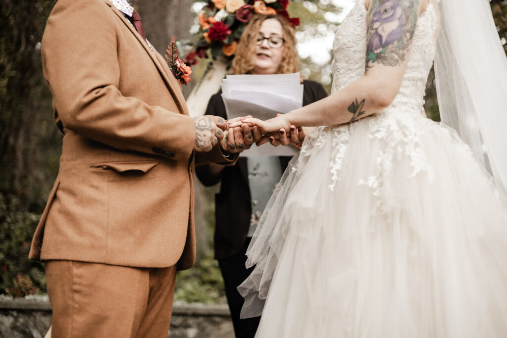 bride and groom exchange rings at this punk wedding in Victoria, BC