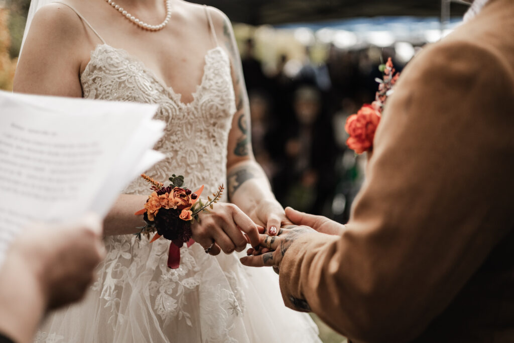 bride and groom exchange rings at this punk wedding in Victoria, BC