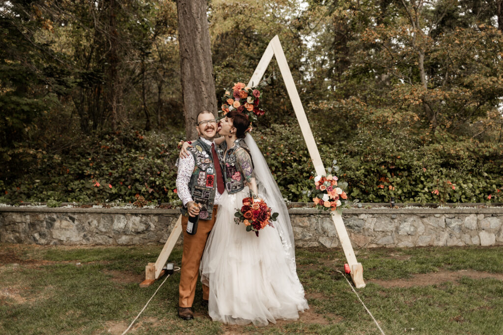 bride licks grooms face in front of the altar at this punk wedding in Victoria, BC