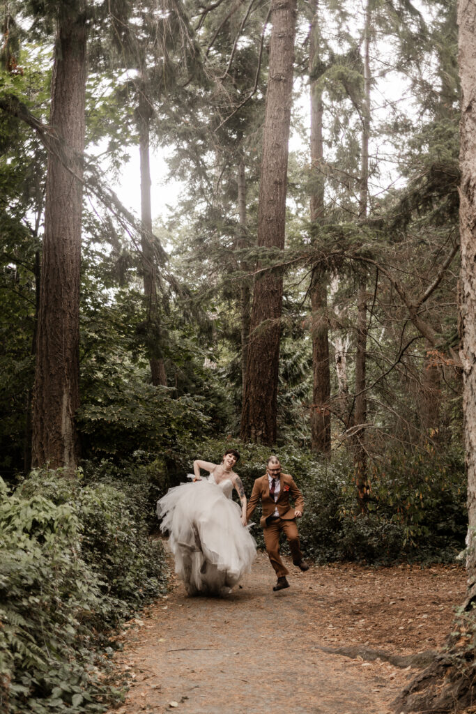 bride and groom click their heels together at thipunk wedding in Victoria, BC