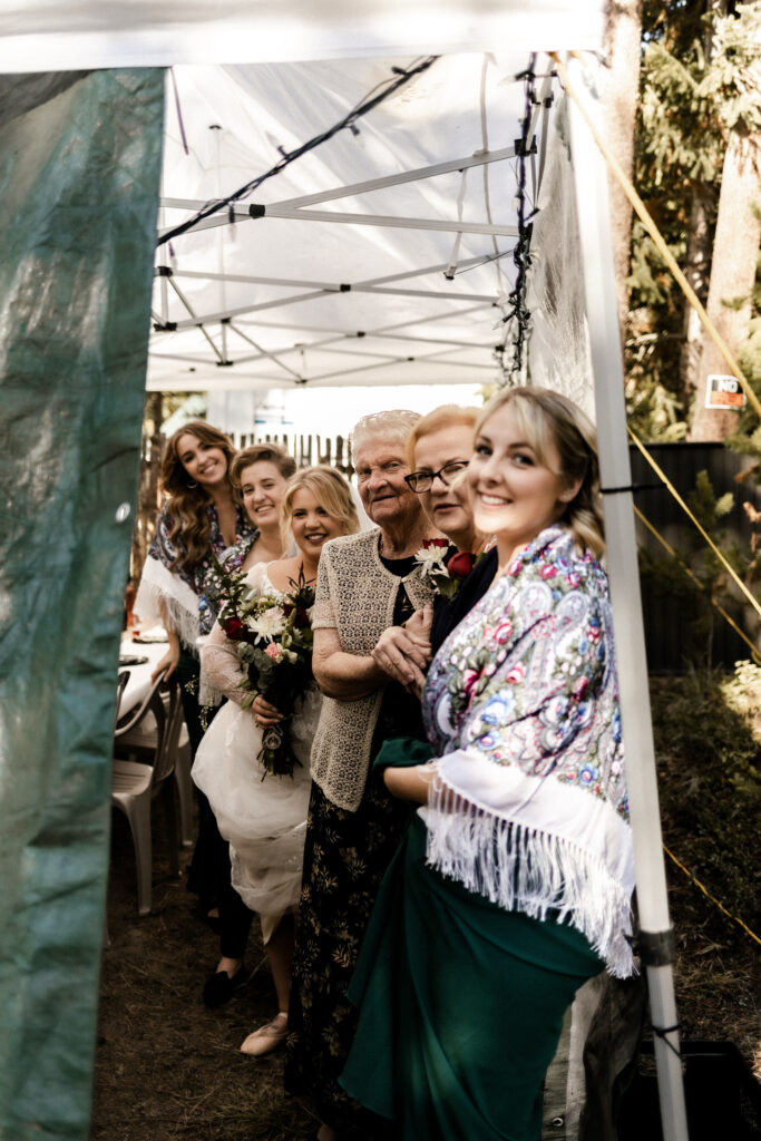 Bridal party waiting to walk down the aisle at this cabin elopement