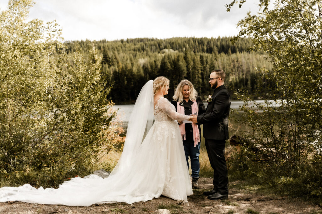 Bride and groom stand at the altar at their legal ceremony at this cabin elopement