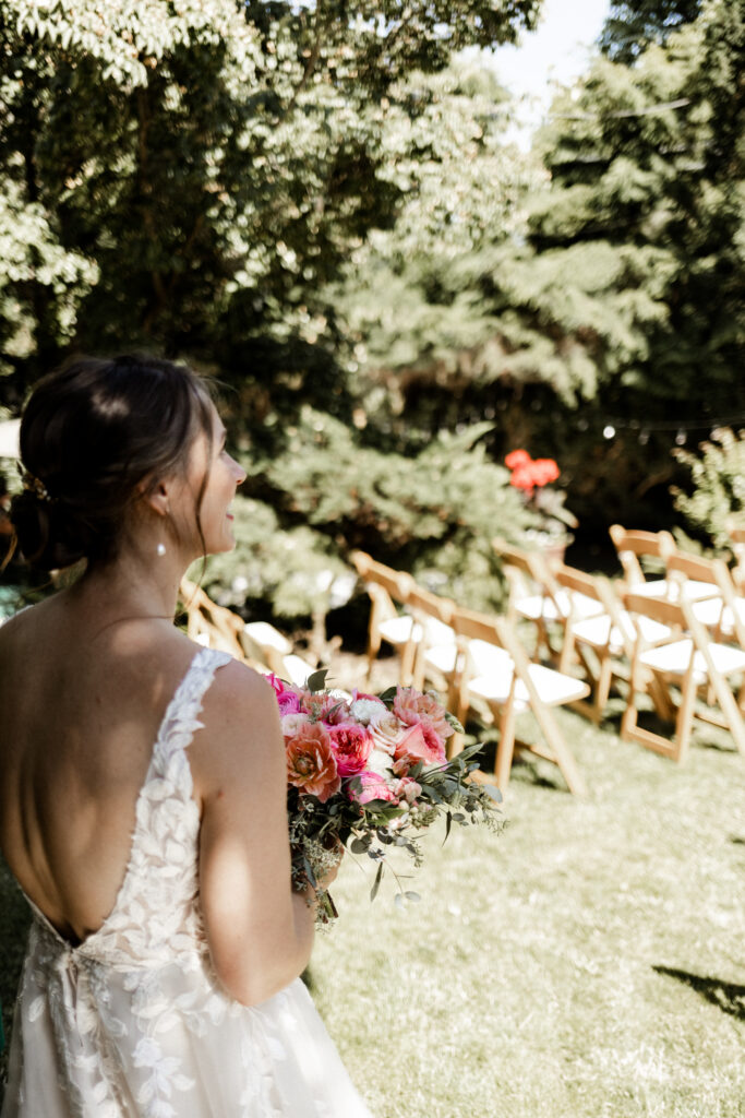 The bride admires the decor at her garden party wedding