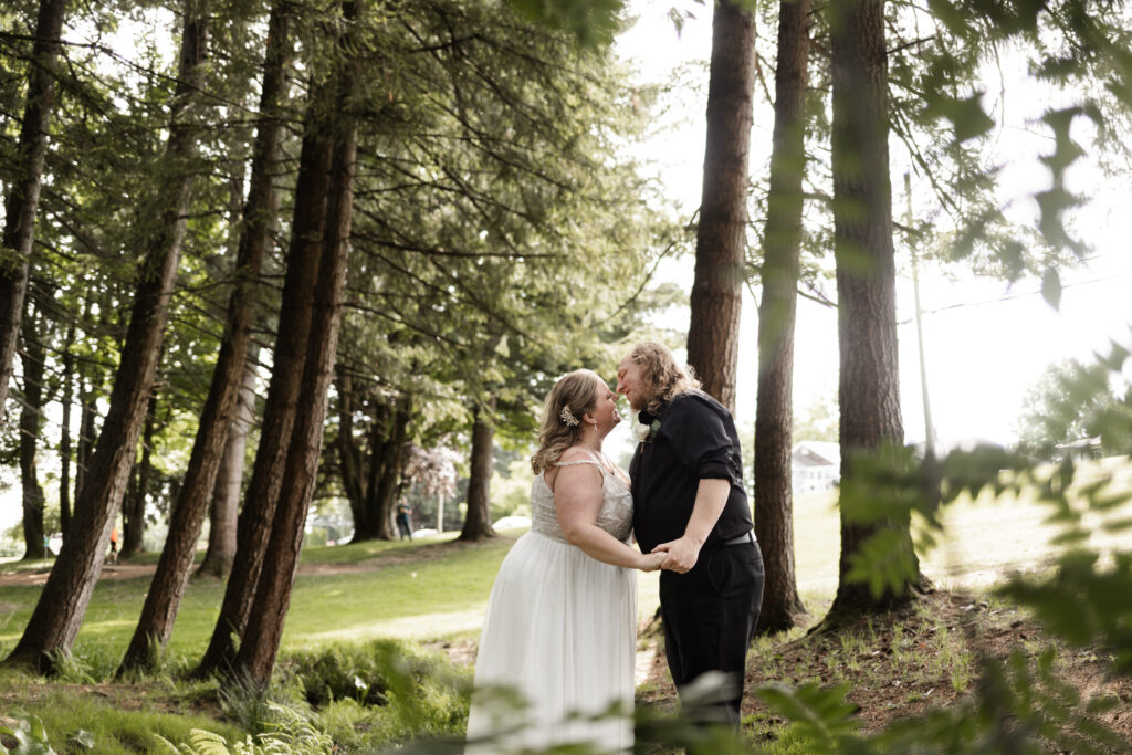 Bride and groom go in for a kiss at their backyard wedding in Mission