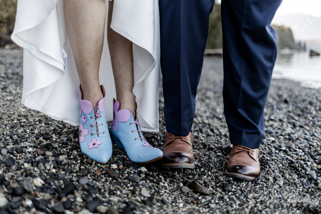 The couple show off their funky shoes at this Camp Elphinstone wedding.