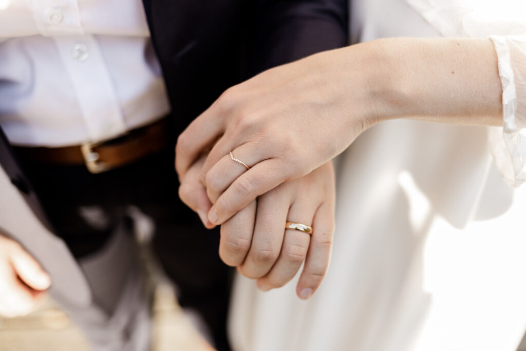 An upclose of the couples wedding rings at this Camp Elphinstone wedding.