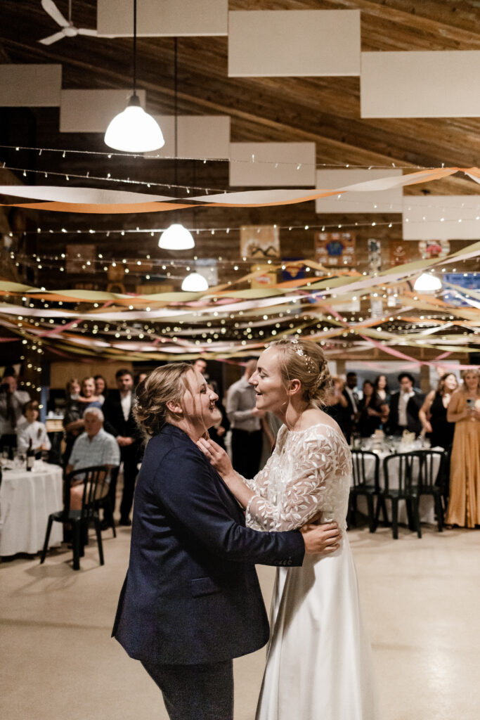 The couple have a first dance as newly weds at this Camp Elphinstone wedding.