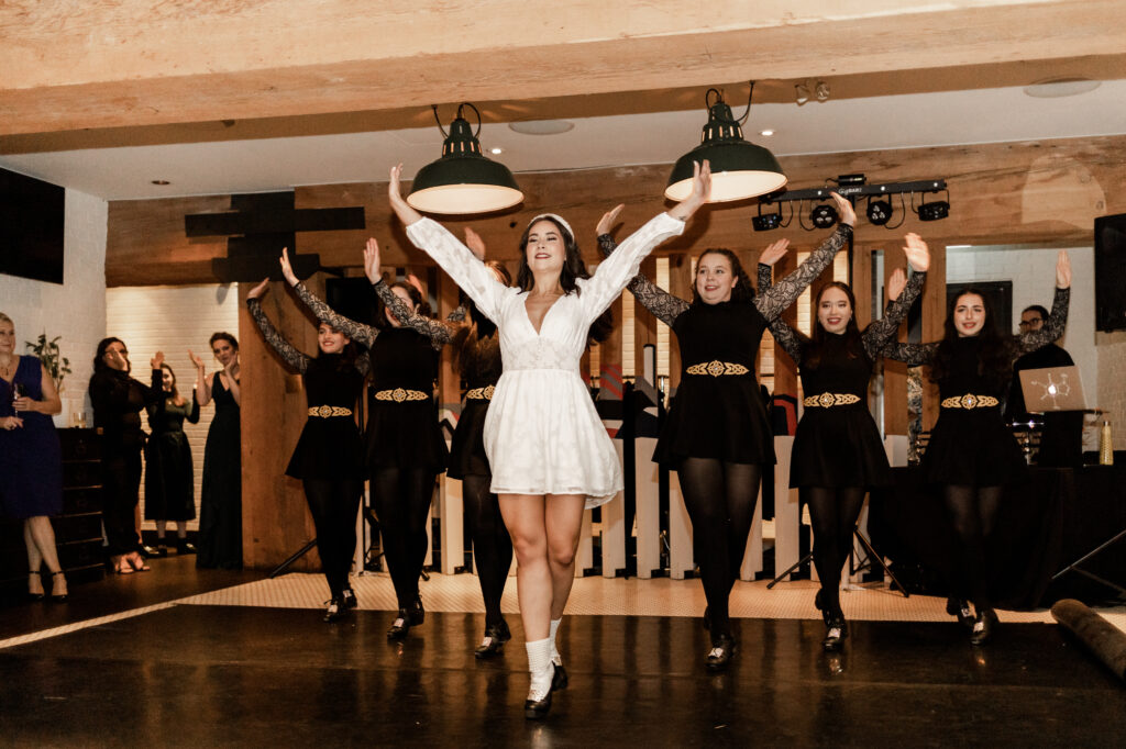 Bride and her dance group perform an Irish dance at Loft at Earls at this downtown Vancouver wedding